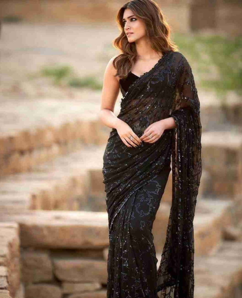 10 Trendy Collection of Black Sarees For Stylish Women black sarees,Black Sarees For Stylish Women,stylish sarees,trendy sarees,Stylish Lace Adventure,Timeless Black Cotton,Party Time in Black,Nighttime Sparkle