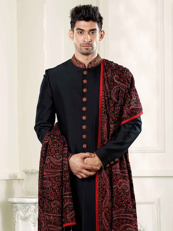 Black Sherwani Designs for a Dazzling Ethnic Look Black Sherwani Designs,Black Sherwani Designs for Ethnic Look,Black Sherwani,Black Sherwani For Groom,Black Velvet Sherwani Design,Designer Black Sherwani,Black and Red Sherwani