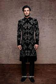 Black Sherwani Designs for a Dazzling Ethnic Look Black Sherwani Designs,Black Sherwani Designs for Ethnic Look,Black Sherwani,Black Sherwani For Groom,Black Velvet Sherwani Design,Designer Black Sherwani,Black and Red Sherwani